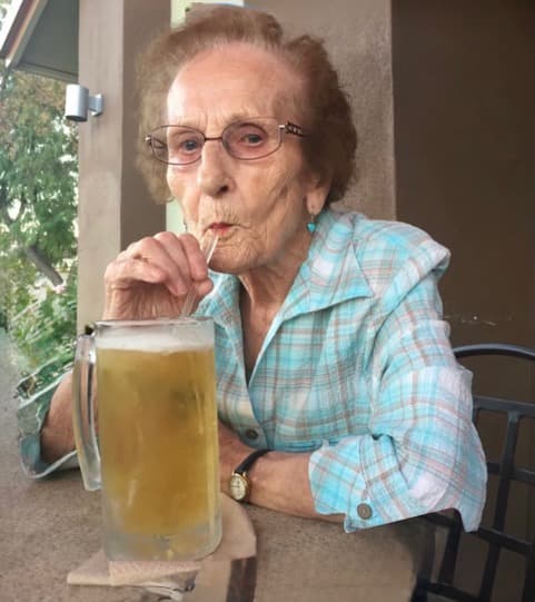 Baba at Hooters, ninety-three years old, drinking the biggest beer through a straw